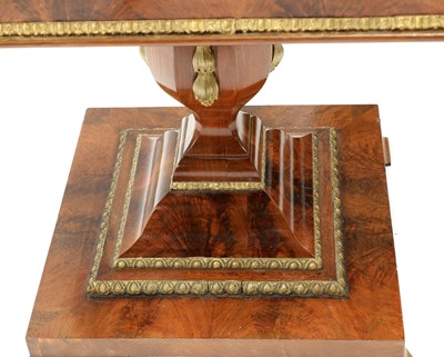 Lot 153 - A flame mahogany and parcel-gilt pedestal centre table