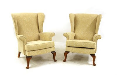 Lot 171 - A pair of Parker Knoll wingback armchairs