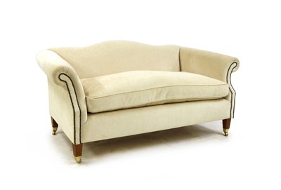 Lot 176 - A modern cream upholstered two seater sofa