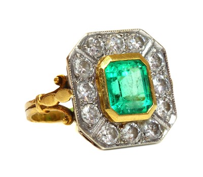 Lot 346 - An 18ct gold emerald and diamond octagonal cluster ring