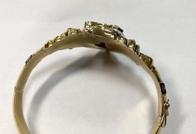 Lot 3 - A Swedish gold paste, split pearl and enamel hollow hinged bangle, c.1850