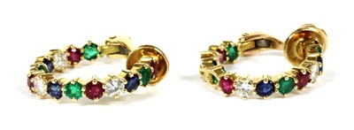 Lot 134 - A pair of gold ruby, emerald, sapphire and diamond hoop earrings