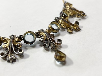 Lot 186 - A silver and gold, blue topaz, split pearl and diamond necklace