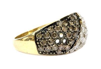 Lot 171 - A 9ct gold fancy brown and white diamond bombé cluster ring