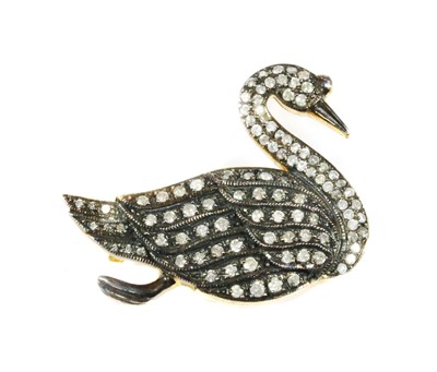 Lot 355 - A silver diamond set swan brooch