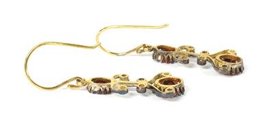 Lot 301 - A pair of silver and gold, garnet and diamond drop earrings