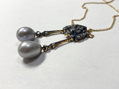 Lot 346 - A silver and gold, cultured freshwater pearl and diamond négligée pendant