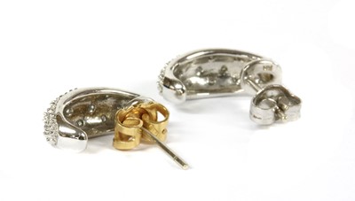 Lot 88 - A pair of 9ct white gold diamond set 'J' hoop earrings