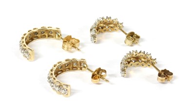 Lot 177 - A pair of 9ct gold diamond set half hoop earrings