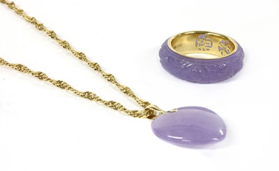 Lot 409 - A carved lavender jade heart pendant