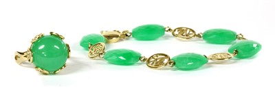 Lot 410 - A 14ct gold green jade ring