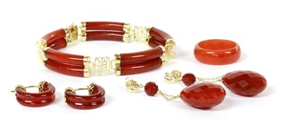 Lot 408 - A 14ct gold red jade bracelet