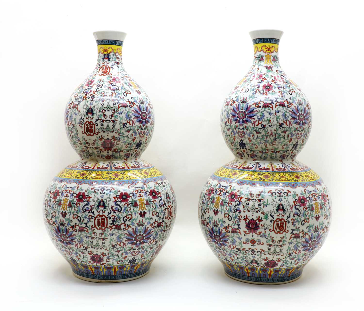 Lot 99 - A pair of modern Chinese doucai double gourd vases