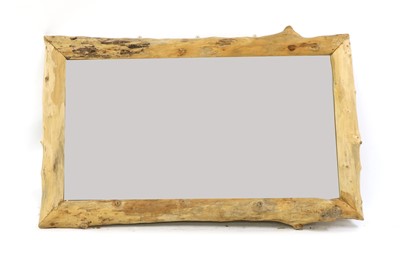 Lot 319 - A large rustic wall mirror