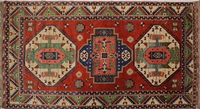 Lot 223 - A hand knotted Kazak rug