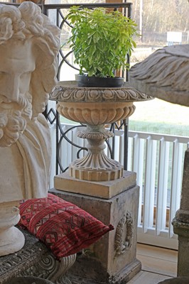Lot 388 - A pair of blush terracotta garden urns