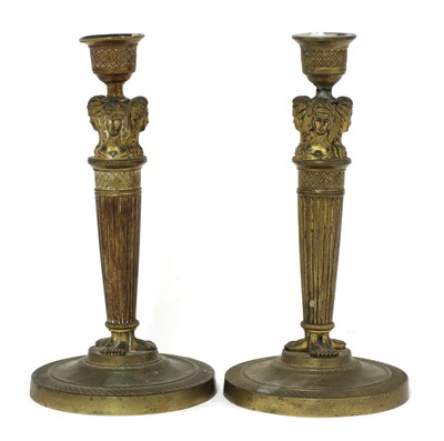 Lot 189 - A pair of Empire gilt bronze candlesticks