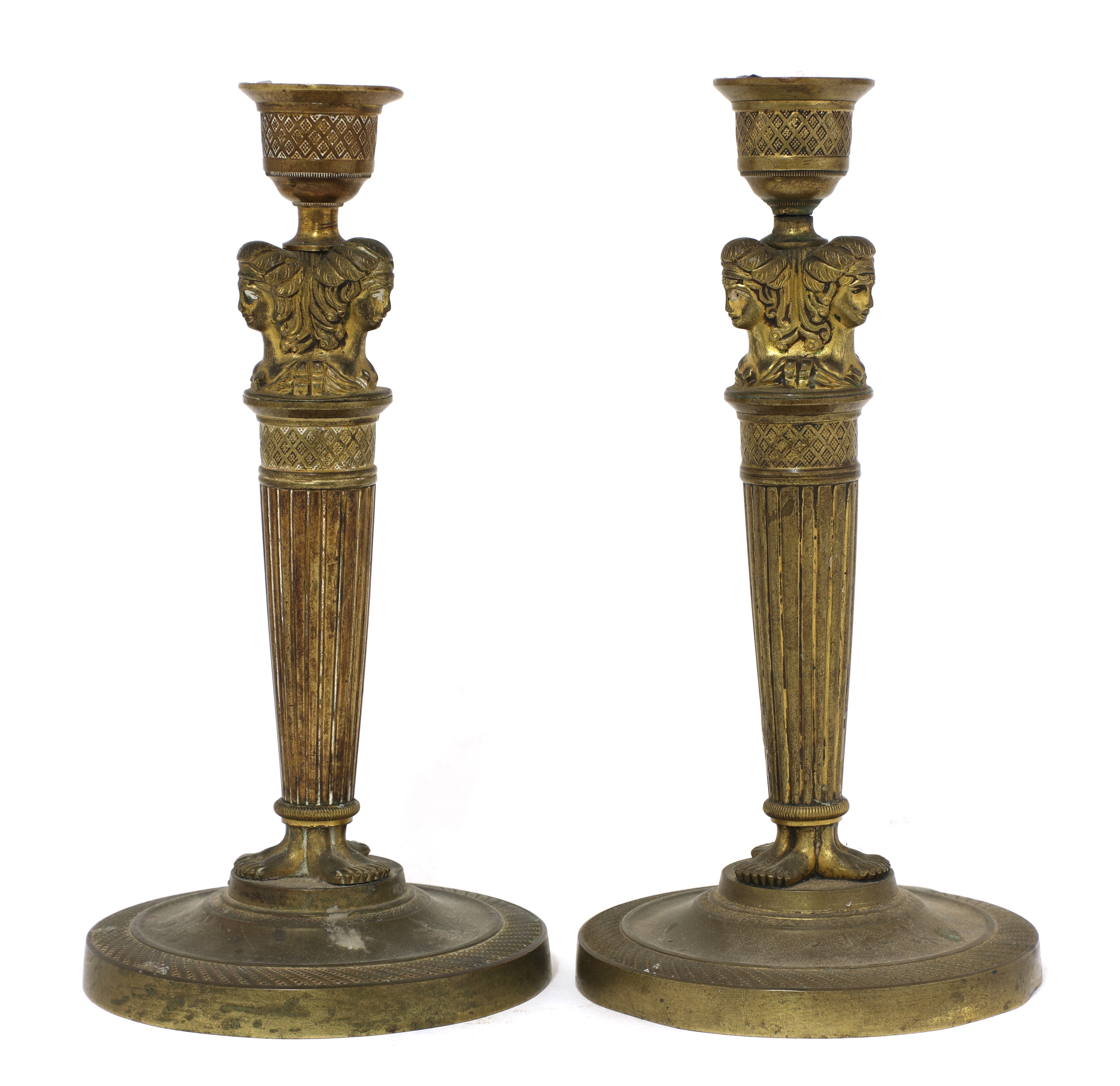 Lot 189 A pair of Empire gilt bronze candlesticks,