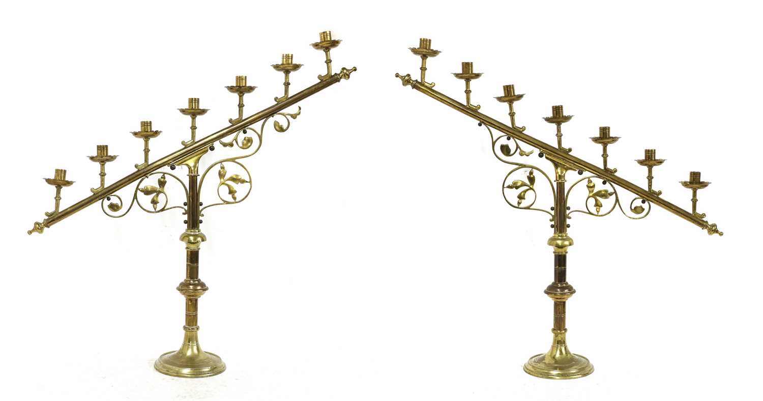 Lot 134 - A pair of brass ecclesiastical candlesticks