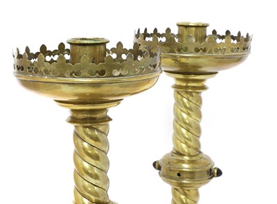 Lot 344 - A pair of brass ecclesiastical candlesticks