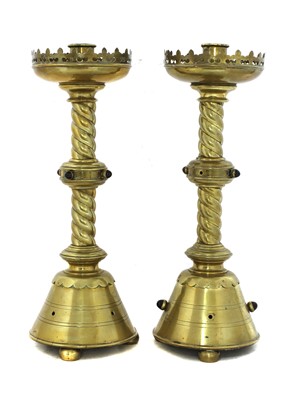 Lot 344 - A pair of brass ecclesiastical candlesticks