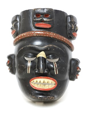 Lot 384 - A large carved wood tribal mask