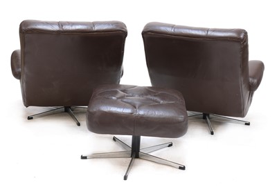 Lot 509 - A pair of chocolate brown lounge chairs