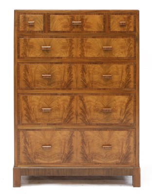 Lot 392 - A walnut crossbanded chest of drawers