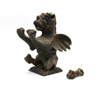 Lot 368 - A carved wooden and ebonised gryphon rampant