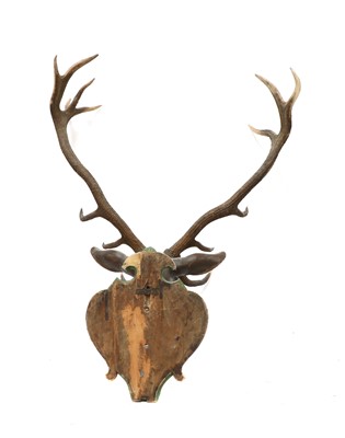 Lot 59 - A carved and polychrome painted wooden stag head