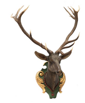 Lot 59 - A carved and polychrome painted wooden stag head