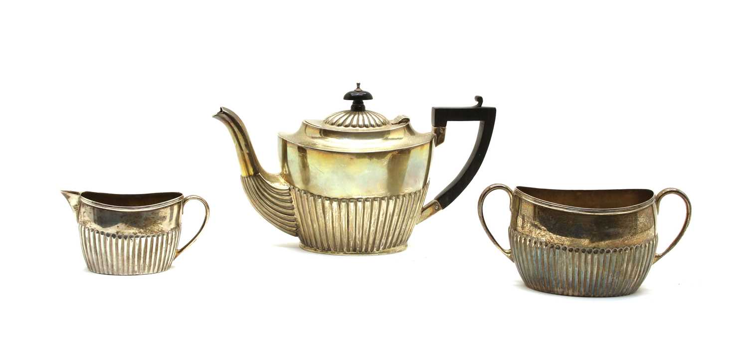 Lot 12 - A matched silver three-piece tea set