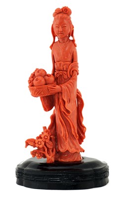 Lot 140 - A Chinese coral figure