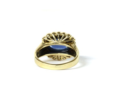 Lot 137 - A gold sapphire and diamond cluster ring