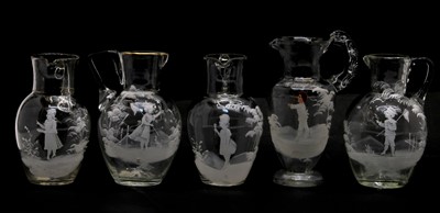 Lot 59 - Five clear glass 'Mary Gregory' jugs