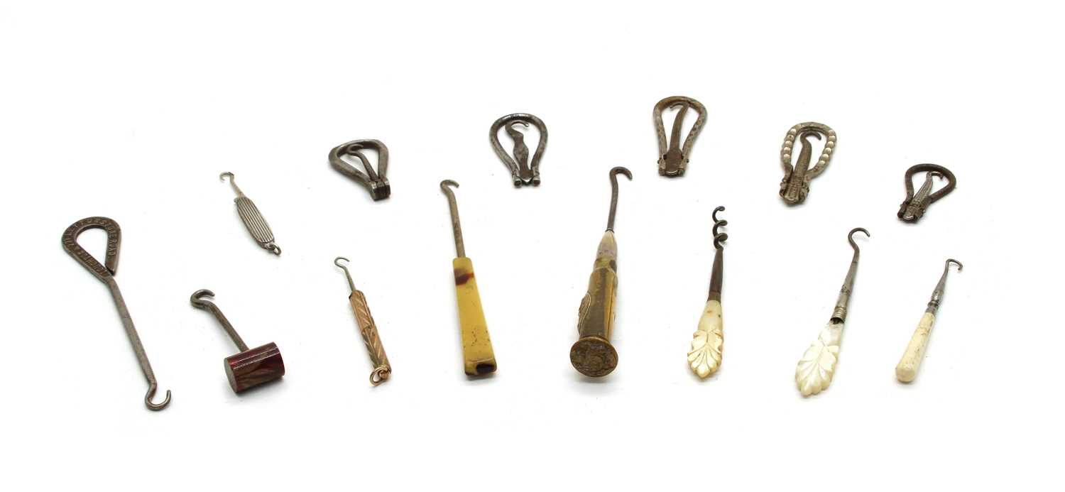 Lot 34 - Approximately  fifty shoe and glove button hooks
