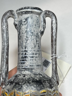Lot 924 - A Roman marbled glass bottle