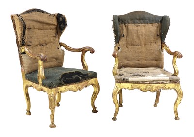 Lot 172 - A pair of Italian carved giltwood wingback open armchairs