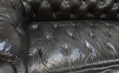 Lot 211 - A large buttoned leather chesterfield sofa