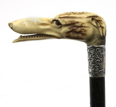Lot 75 - A late Victorian bone and ebonised rosewood walking stick