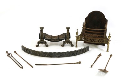Lot 230 - A cast-iron and brass fire basket