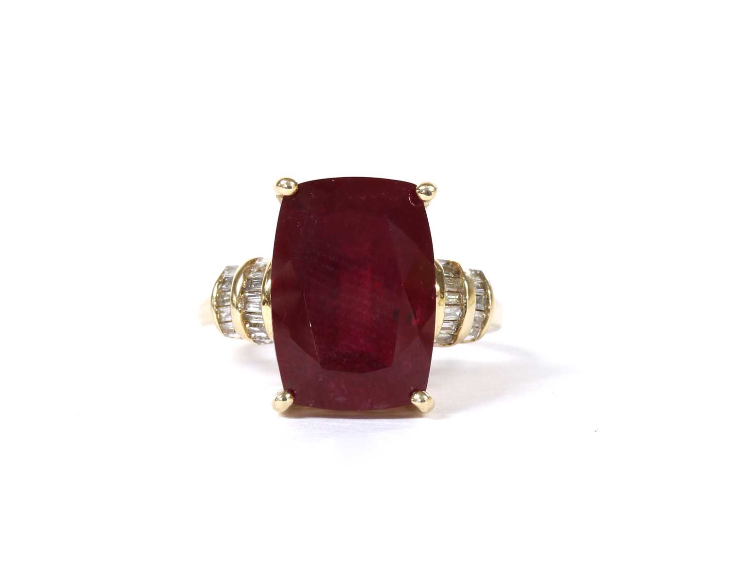 Lot 105 - A gold fracture filled ruby and diamond ring