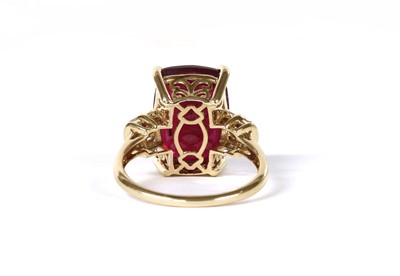 Lot 105 - A gold fracture filled ruby and diamond ring