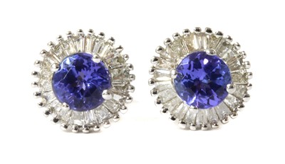 Lot 147 - A pair of white gold tanzanite and diamond cluster stud earrings