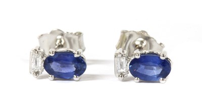 Lot 132 - A pair of white gold sapphire and diamond stud earrings