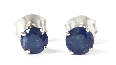 Lot 134 - A pair of white gold single stone sapphire stud earrings