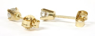 Lot 43 - A pair of gold single stone diamond stud earrings