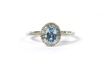 Lot 157 - A white gold aquamarine and diamond cluster ring