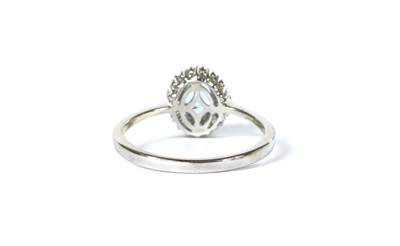 Lot 157 - A white gold aquamarine and diamond cluster ring