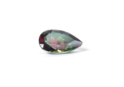 Lot 216 - An unmounted pear mixed cut mystic topaz